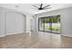 Open living room featuring large sliding glass doors offering backyard views at 17651 Bright Wheat Dr, Lithia, FL 33547