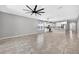 Bright open-concept living space featuring tile floors and modern kitchen at 17651 Bright Wheat Dr, Lithia, FL 33547