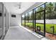 Screened in patio with ceiling fan and outdoor access to the lush green yard at 17651 Bright Wheat Dr, Lithia, FL 33547