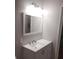 Bright bathroom with a modern vanity, mirror, and sink with a brushed nickel faucet at 1922 Marvy Ave, Tampa, FL 33612