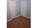 A bedroom with closet and access doors, complemented by clean white trim at 1922 Marvy Ave, Tampa, FL 33612