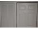 A full view of two closets with white doors, one with slatted design at 1922 Marvy Ave, Tampa, FL 33612