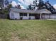 Cozy single-story home boasts a carport and a spacious front yard at 1922 Marvy Ave, Tampa, FL 33612