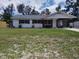 Charming single-story home with a carport and well-maintained front lawn at 1922 Marvy Ave, Tampa, FL 33612