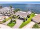 Stunning waterfront home featuring lush landscaping, a private dock, and panoramic ocean views at 2002 Carolina Ne Cir, St Petersburg, FL 33703
