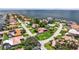 Waterfront neighborhood aerial view showcasing beautiful houses, manicured landscaping, and sparkling water access at 2002 Carolina Ne Cir, St Petersburg, FL 33703