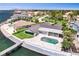 Beautiful waterfront home with a private dock, an inground pool, green lawn, and stunning bay views at 2002 Carolina Ne Cir, St Petersburg, FL 33703