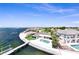 Aerial view of the waterfront property showing dock, sparkling pool, landscaping, and stunning coastal location at 2002 Carolina Ne Cir, St Petersburg, FL 33703