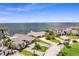 Expansive aerial view featuring waterfront homes, mature trees, and picturesque landscaping at 2002 Carolina Ne Cir, St Petersburg, FL 33703