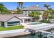 A waterfront home with a backyard swimming pool and private dock offers a perfect blend of relaxation and nautical adventure at 2002 Carolina Ne Cir, St Petersburg, FL 33703