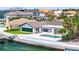 A waterfront backyard with a pool, a dock, and a patio in a serene setting makes for a perfect relaxation experience at 2002 Carolina Ne Cir, St Petersburg, FL 33703
