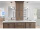 Bathroom boasts double vanity with marble countertop, modern fixtures, and cabinetry at 2002 Carolina Ne Cir, St Petersburg, FL 33703