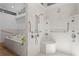 Modern bathroom featuring walk-in shower, chrome fixtures, shower seat, and soaking tub with convenient grab bars at 2002 Carolina Ne Cir, St Petersburg, FL 33703