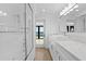 Modern bathroom with tiled shower, and view to the water at 2002 Carolina Ne Cir, St Petersburg, FL 33703