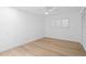 Cozy bedroom with shuttered window, neutral walls, and built-in closet space at 2002 Carolina Ne Cir, St Petersburg, FL 33703