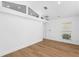Bright bedroom with wood floors, high ceilings, modern window, and shutters provides a stylish, comfortable retreat at 2002 Carolina Ne Cir, St Petersburg, FL 33703