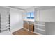 Walk-in closet with custom shelving and a window offering scenic ocean views at 2002 Carolina Ne Cir, St Petersburg, FL 33703