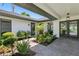 Beautiful courtyard features a stone path leading to the entrance with lush tropical landscaping at 2002 Carolina Ne Cir, St Petersburg, FL 33703