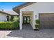 Inviting front entrance featuring a decorative doorway, a well-maintained facade, and a paver walkway at 2002 Carolina Ne Cir, St Petersburg, FL 33703