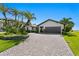 Charming home features a stone driveway, two-car garage, and well-manicured landscaping at 2002 Carolina Ne Cir, St Petersburg, FL 33703