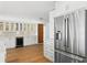 Contemporary kitchen featuring custom cabinetry, a stainless steel refrigerator, and ample counter space at 2002 Carolina Ne Cir, St Petersburg, FL 33703