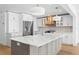 Gourmet kitchen with marble countertops, stainless steel appliances, and a custom range hood at 2002 Carolina Ne Cir, St Petersburg, FL 33703