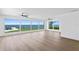 Living room with large windows offering a beautiful water view at 2002 Carolina Ne Cir, St Petersburg, FL 33703