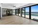 Modern living room with sliding glass doors opening to a waterfront pool and patio at 2002 Carolina Ne Cir, St Petersburg, FL 33703