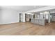 Open-concept layout featuring living room and kitchen with recessed lighting and wood flooring at 2002 Carolina Ne Cir, St Petersburg, FL 33703