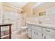 Cozy bathroom with walk-in shower, vanity, and matching wallpaper at 2254 Norwegian Dr # 22, Clearwater, FL 33763