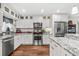 Bright kitchen featuring granite countertops, stainless steel appliances, and custom cabinetry at 2254 Norwegian Dr # 22, Clearwater, FL 33763