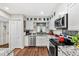 Well-lit kitchen featuring stainless steel appliances, granite countertops, and hardwood flooring at 2254 Norwegian Dr # 22, Clearwater, FL 33763