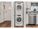 Convenient laundry area with stacked washer and dryer, adjacent to the kitchen at 2254 Norwegian Dr # 22, Clearwater, FL 33763