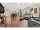 Spacious open-concept featuring hardwood floors, ceiling fan, and kitchen views at 2254 Norwegian Dr # 22, Clearwater, FL 33763