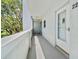 Exterior porch showing covered entry door and stairs leading up at 2254 Norwegian Dr # 22, Clearwater, FL 33763