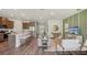 Bright, open-concept living space that flows into a modern kitchen and dining area at 2333 Stratten Dr, Zephyrhills, FL 33541