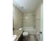 Bathroom featuring a shower-tub combo with tiled walls and updated fixtures at 2411 Willimette Dr, Wesley Chapel, FL 33543