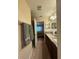 Bathroom with double sinks, granite countertop, and access to shower and bedroom at 2411 Willimette Dr, Wesley Chapel, FL 33543