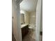 Cozy bathroom with granite countertop, wood vanity, tiled floors, and a shower-tub combo at 2411 Willimette Dr, Wesley Chapel, FL 33543
