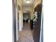 Inviting foyer with tile floors and an open view to the spacious living area at 2411 Willimette Dr, Wesley Chapel, FL 33543