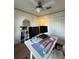 Bright home office with a modern desk setup, and a built-in bookcase for storage and decor at 2411 Willimette Dr, Wesley Chapel, FL 33543