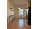 Eat-in kitchen area with stylish floating shelves and natural light at 2411 Willimette Dr, Wesley Chapel, FL 33543