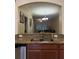 Kitchen sink area overlooking the living area, granite countertops, and ample lighting at 2411 Willimette Dr, Wesley Chapel, FL 33543