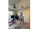 Office featuring a ceiling fan, desk with computer monitors, and a window for natural light at 2411 Willimette Dr, Wesley Chapel, FL 33543