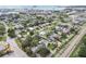 Panoramic aerial view of a charming neighborhood with mature trees and well-maintained homes at 2452 Bayshore Blvd, Dunedin, FL 34698