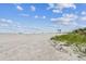 Expansive beach with soft sands and tranquil waters on a beautiful, clear day at 2452 Bayshore Blvd, Dunedin, FL 34698