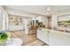 Open concept living area with stylish shelving, island seating, and hardwood flooring at 2452 Bayshore Blvd, Dunedin, FL 34698
