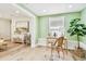 Inviting office area showcases hardwood floors, and natural light with seamless access to living area at 2452 Bayshore Blvd, Dunedin, FL 34698
