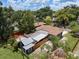 Aerial view shows the layout of the home, the large lot, and surrounding greenery at 2819 N Central Ave, Tampa, FL 33602