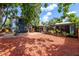 Large backyard features a patio, fire pit, and lush landscaping at 2819 N Central Ave, Tampa, FL 33602